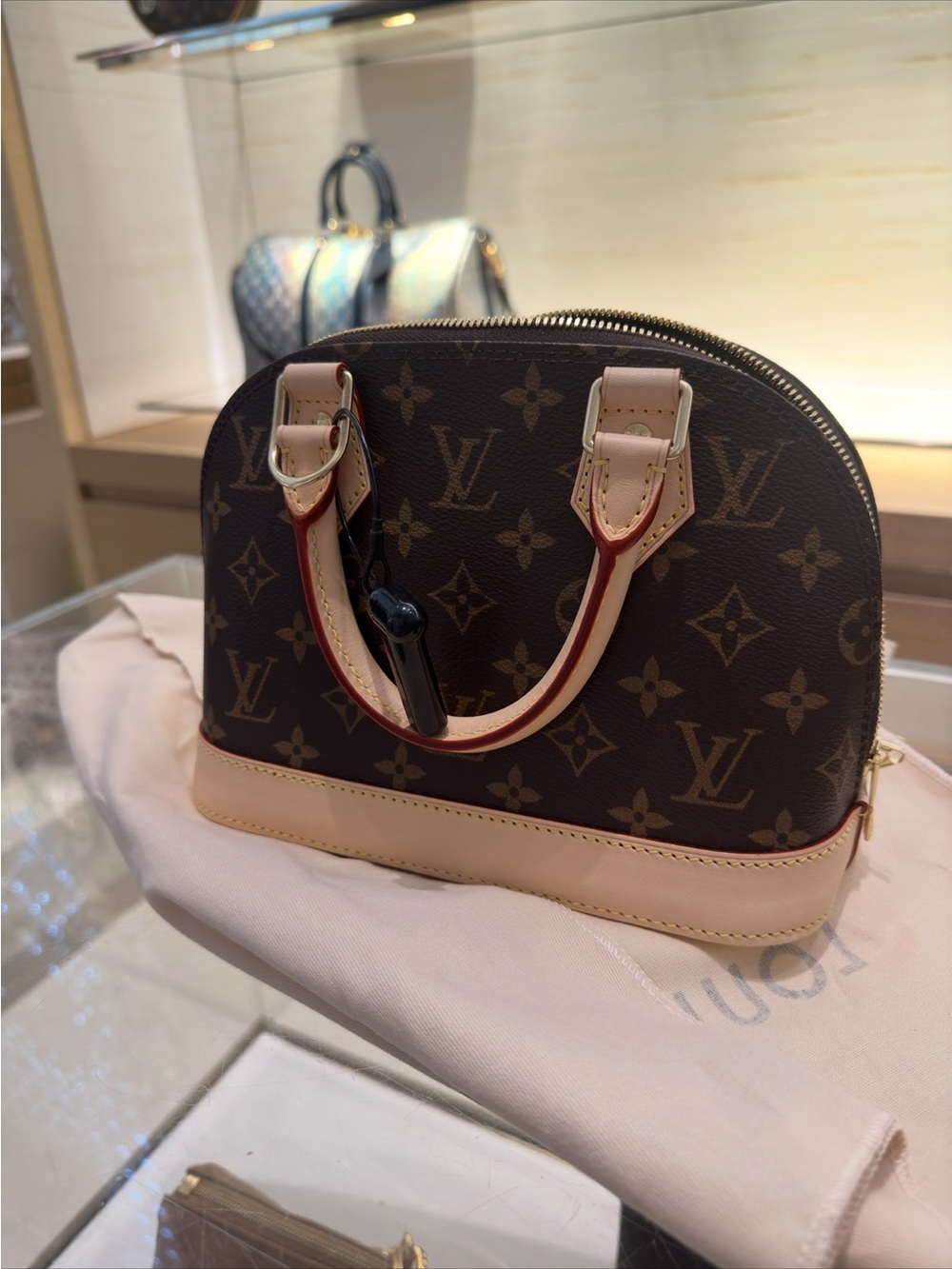Louis Vuitton Monogram Alma Satchel in Brown with Natural Trim
